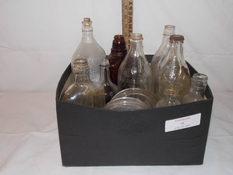 lot 98 image: Various old bottles and chicken Waterers