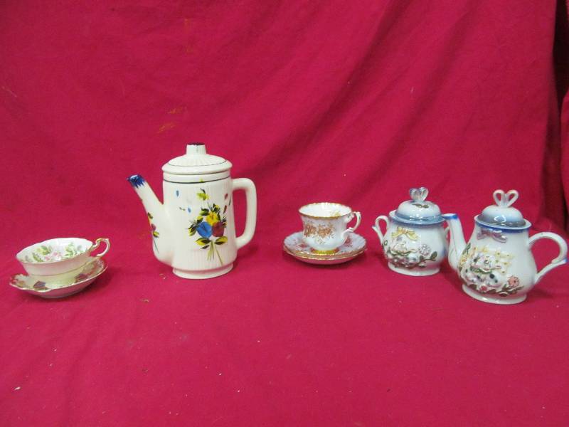 lot 85 image: fine china tea cups and tea pots