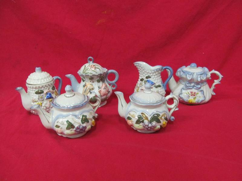 lot 94 image: teapots, sugar and cream set