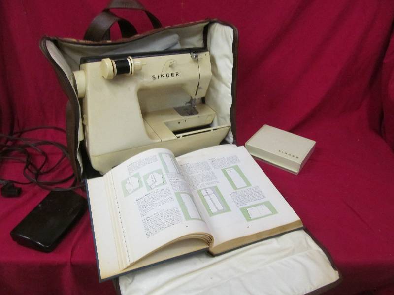 lot 102 image: Vintage traveling Singer  sewing machine