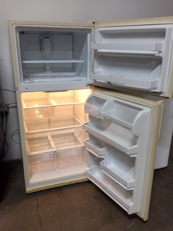 lot 12 image: Kenmore Bisque Top Freezer Fridge