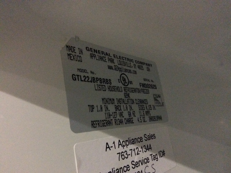 lot 6 image: GE Stainless Steel Top Freezer Fridge