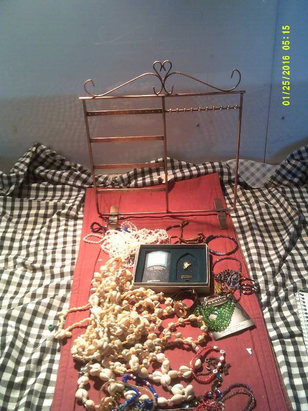 lot 31 image: JEWLERY STAND , LOONEY TOONS WATCH , SHELL NECKLACES , LOTS OF JEWLERY