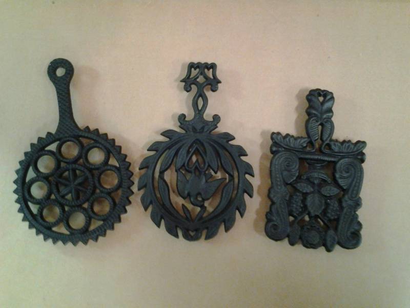 lot 21 image: 3-Griswold Cast Iron Trivets
