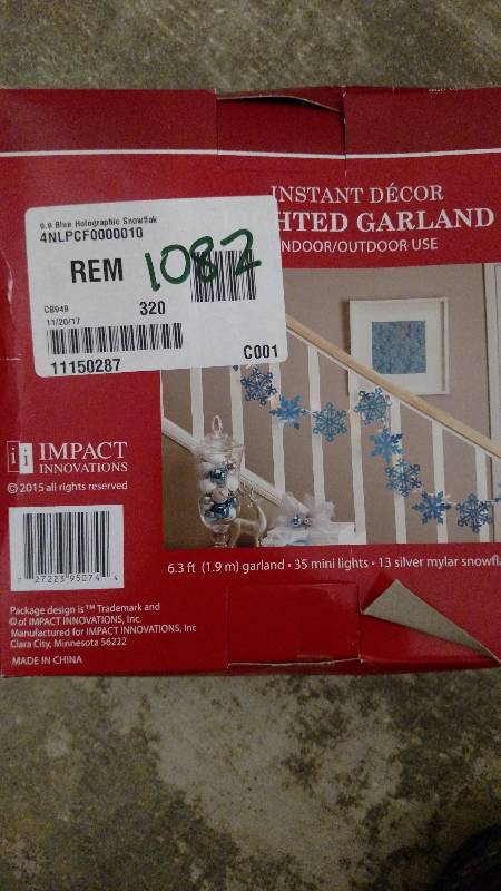 lot 1082 image: Northlight Seasonal 9.9 Blue Holographic Snowflake Christmas Light Garland with 35 Clear Mini Lights - White Wire
