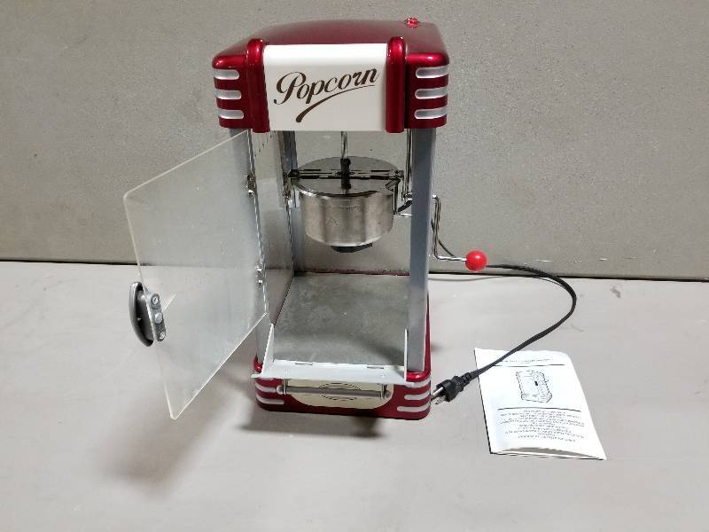 lot 8 image: Used Nostalgia Electrics Popcorn Machine & A used Black & Decker 12 cup Coffee Pot