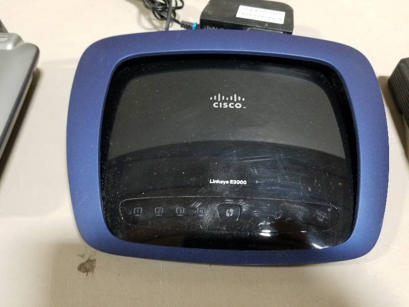 lot 29 image: 2 Wifi Routers and a Cable Modem- Used