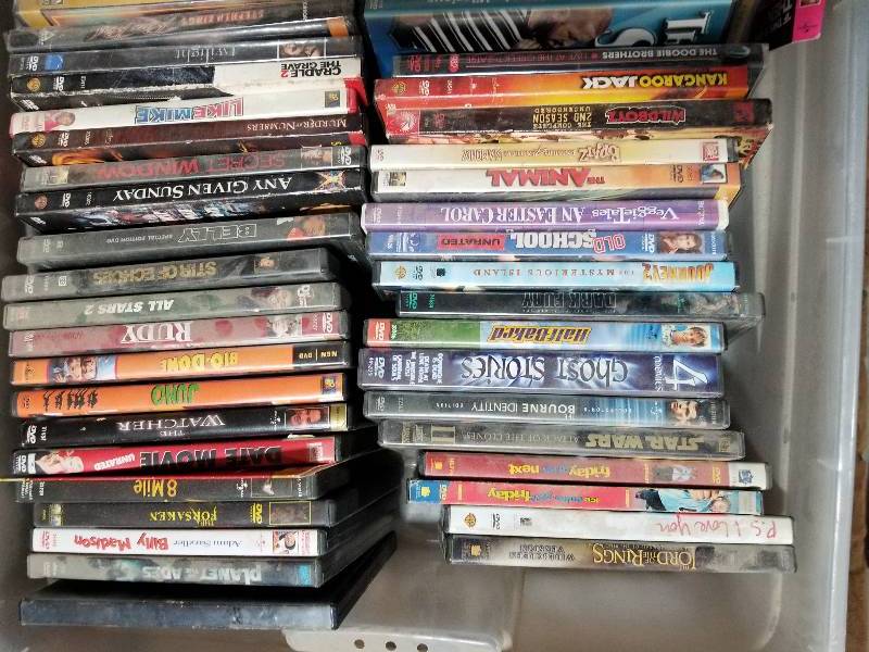 lot 19 image: Dozens of Used Dvds and Two Used Dvd Players