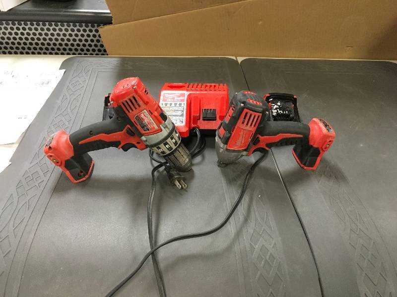 lot 5 image: Milwaukee M18 18-Volt Lithium-Ion Cordless Drill DriverImpact Driver Combo Kit in working conditions