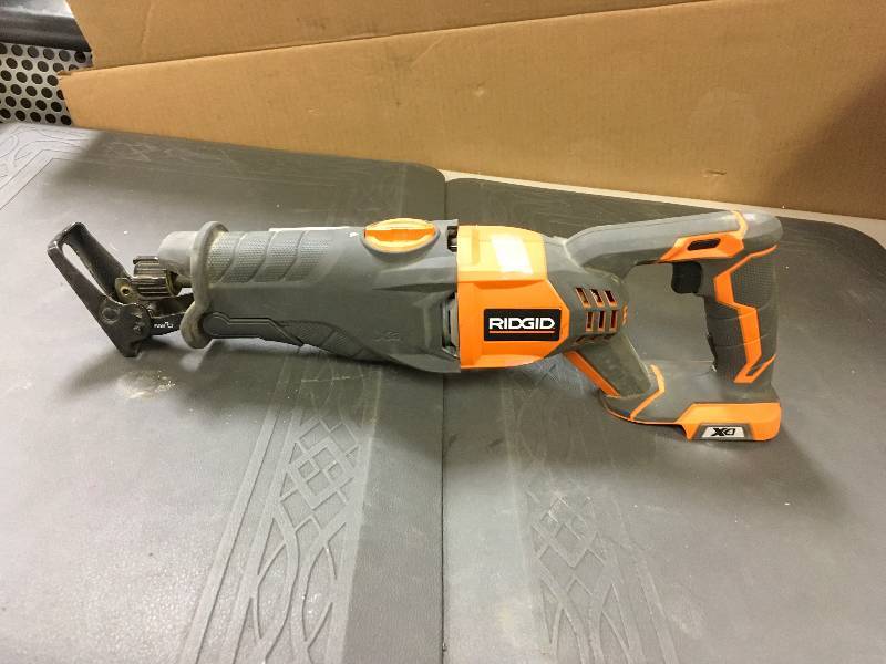 lot 11 image: Ridgid X4 18-Volt Hyper Lithium-Ion Cordless Reciprocating Saw in  working conditions