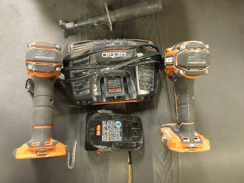 lot 21 image: Ridgid 18 Volt Brushless 12 Hammer Drill & Impact Driver in  working conditions
