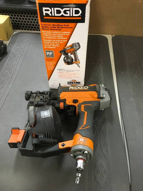 lot 41 image: Ridgid 1-34 in. Roofing Coil Nailer with Magnesium Metal Housing in working conditions