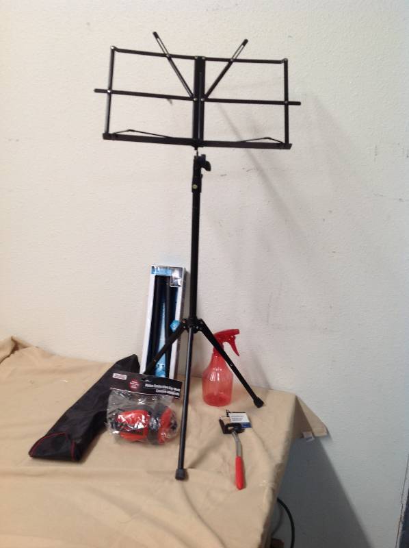 lot 72 image: Music Stand, Drum Sticks, Selfie Stick, Noise Reduction Ear Muffs and squirt Bottle