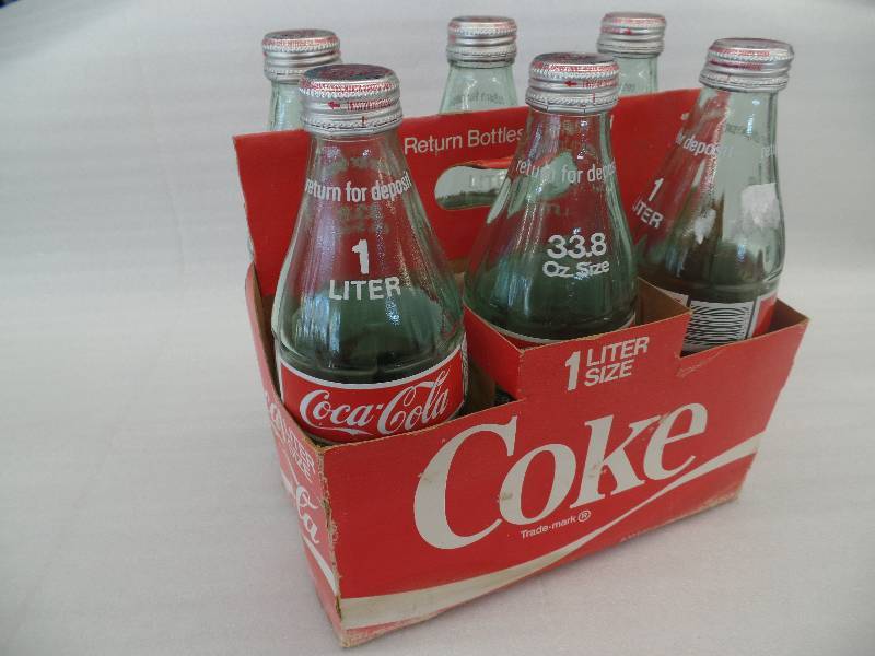 lot 52 image: 1L Glass Coke Bottles