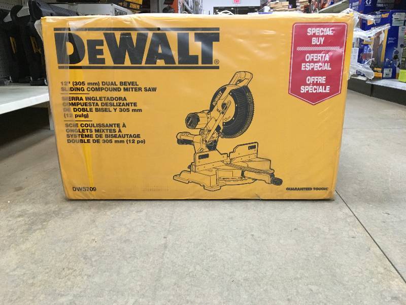 lot 106 image: Dewalt DWS709 15 Amp 12 in. Dual Bevel Sliding Compound Miter Saw not used