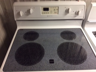 lot 10 image: Whirlpool Accubake Glass Top Electric Stove