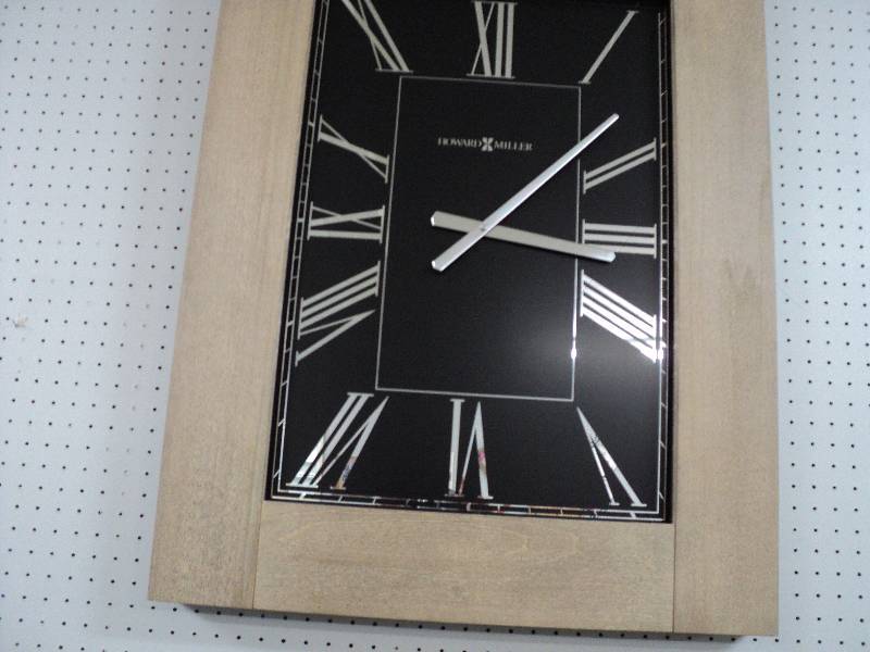 lot 1 image: howard miller clock, 27in wide x 35...