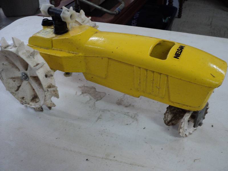 lot 107 image: cast iron neslon tractor sprinkler...