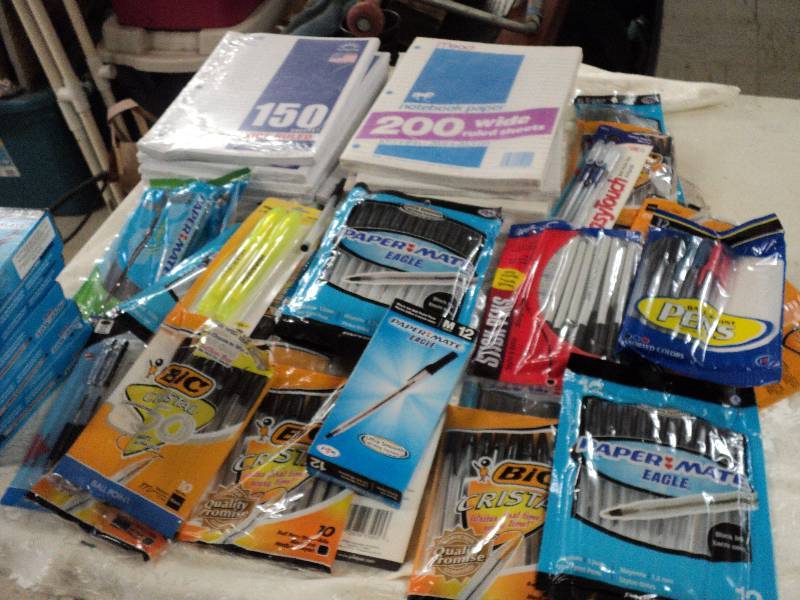 lot 222 image: notebook, paper and pens in covered...