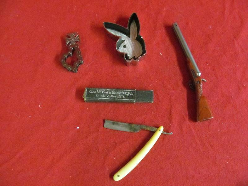 lot 7 image: Antique razor, ashtray, lighter, bottle opener