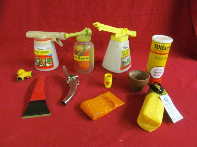 lot 103 image: Ortho sprayers, Wilson Tennis balls, ice scrappers, adult poncho