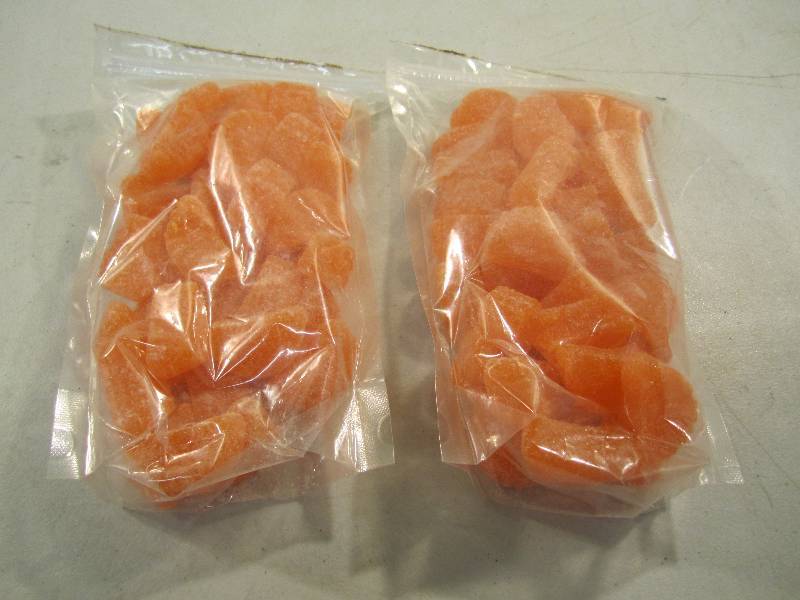 lot 125 image: 2 Bags of Orange Slice Chewy Candy...