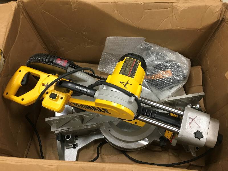 lot 74 image: DEWALT  15 Amp 12 in. Double Bevel Sliding Compound Miter Saw Model # DWS780  open box never used