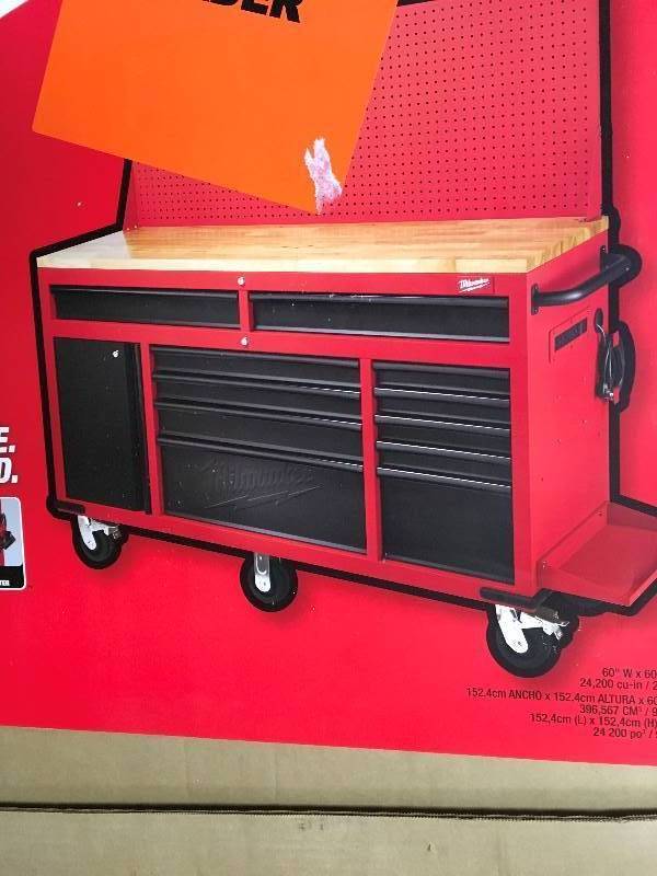 lot 79 image: Milwaukee 60.125 in. 11-Drawer and 1-Door 22 in. D Mobile Workbench with Sliding Pegboard Back Wall, Red and Black  Model#  48-22-8560 open box never used