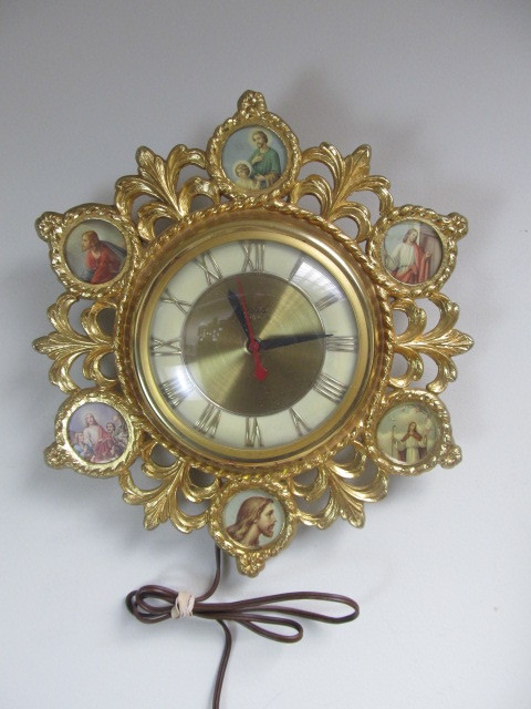 lot 52 image: Vintage UNITED Gilt Metal Wall Clock wReligious Pictures