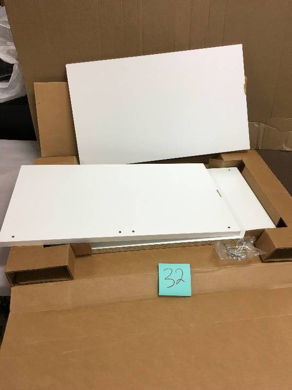 24 in. Shoe Shelf damaged on edge please review pictures