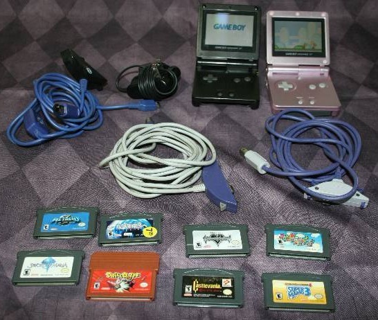 Two Nintendo GameBoy Advance SP and Accessories and Games