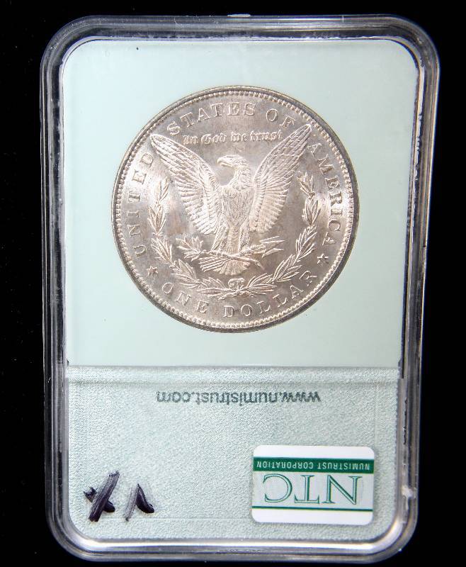lot 14 image: 1885 MORGAN SILVER DOLLAR MS66 NTC
