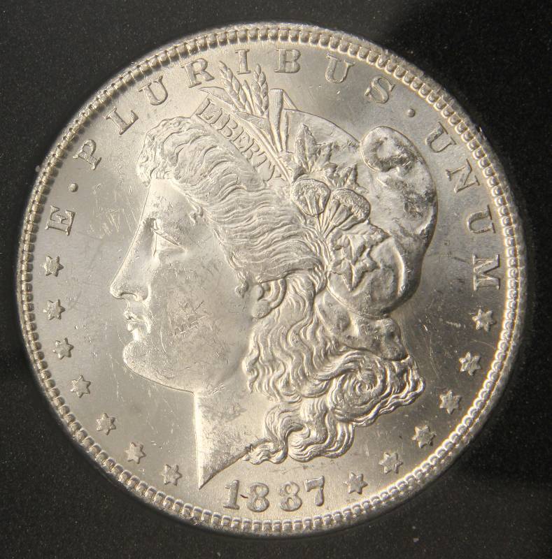 lot 12 image: 1887-S MORGAN SILVER DOLLAR MS64 PGSA