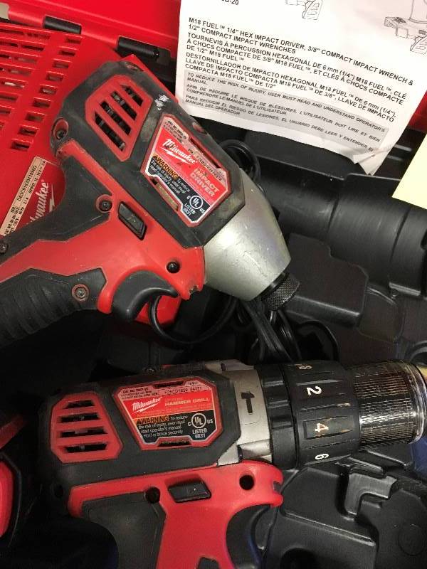Millwaukee M18 Cordless Impact Driver And 12 In. Hammer Drill Kit used in good working condition