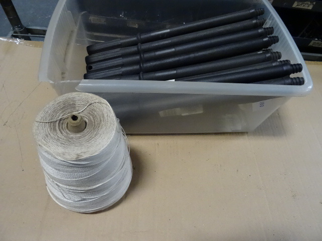 Roll of string. Plastic screw in ha...
