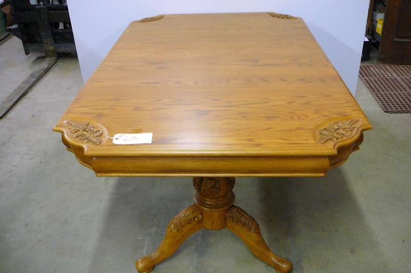 lot 63 image: Wooden Dinning Room Table Oak Carvings in Corners Nice