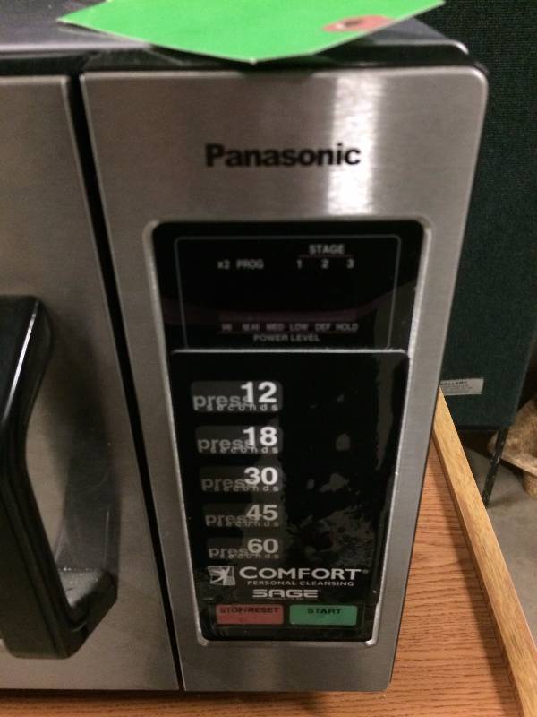 lot 17 image: Panasonic Stainless 1000W 0.8 Cu. Ft. Commercial Microwave Oven Current Settings Are For Warming Towels Etc.  Please see pictures