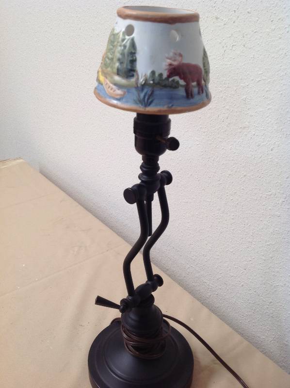 lot 84 image: Small Lamp. with a Bear and Moose on the Shade