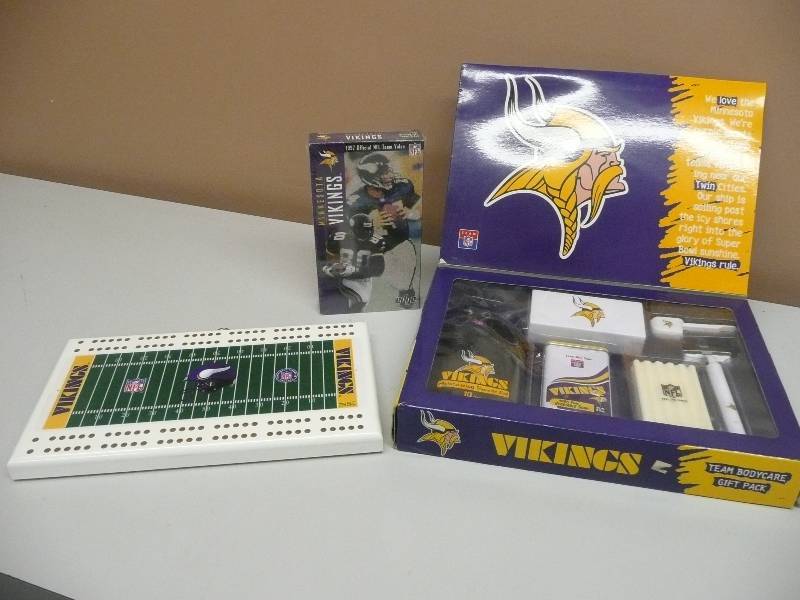 lot 31 image: VINTAGE 1997 VIKINGS HANGING CRIBBAGE BOARD, VINTAGE UNUSED VIKINGS TEAM BODY CARE PACK & 1997 VIKINGS OFFICIAL NFL TEAM VIDEO UNOPENED - SEE PICTURES