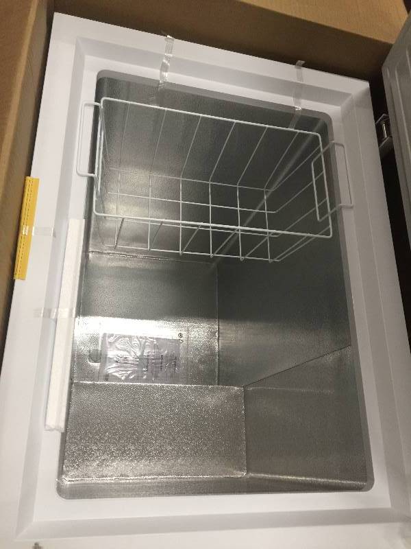 lot 3 image: Haier 5.0 cu. Ft. Chest Freezer Model #  HF50CM23NW in White open box with smal damage on the botton corner stock photo used to display item