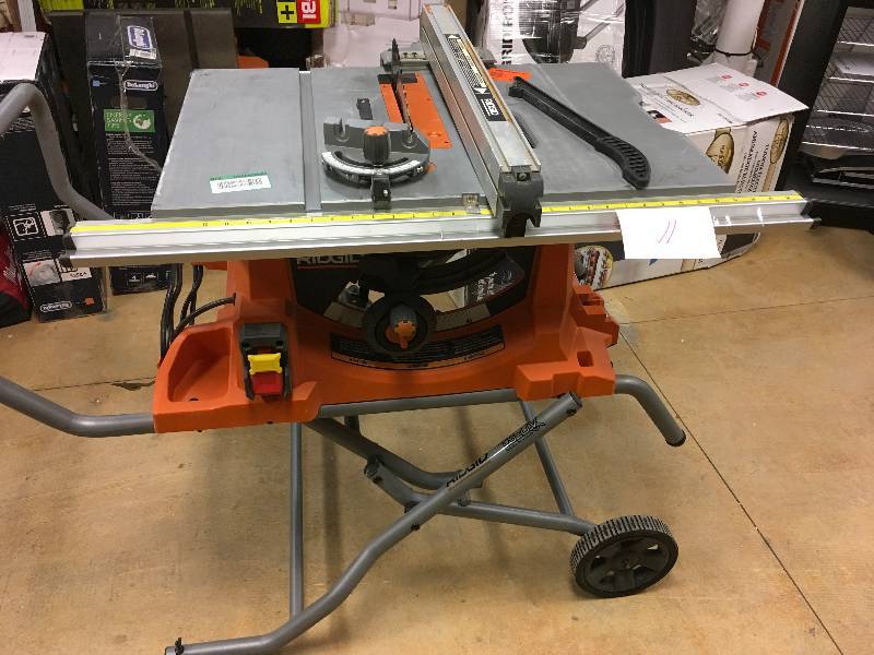 Ridgid 15 Amp 10 in. Heavy-Duty Portable Table Saw with Stand slight damage and scratches present in good working condition