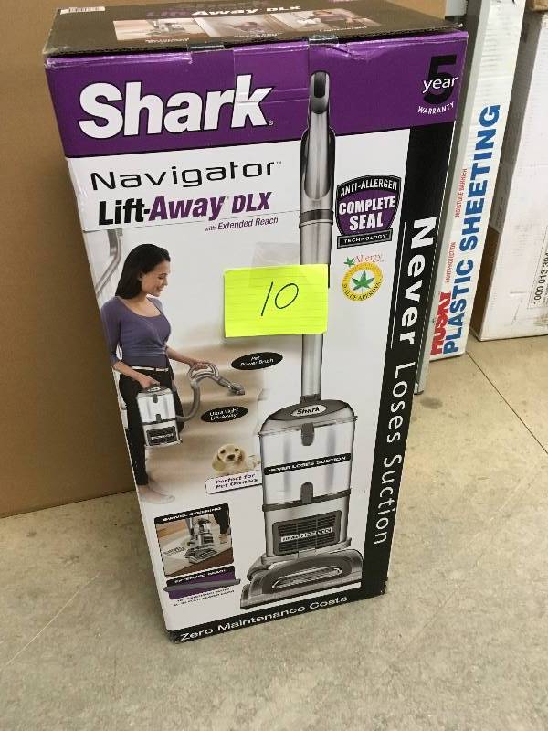 lot 10 image: Shark Navigator TM Lift-Away Deluxe Upright Vacuum with Extended Reach not used