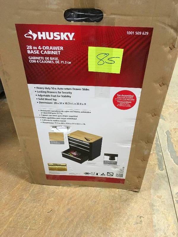 lot 85 image: Husky 33 in H x 28 in W x 18 in. D 4 Drawer Steel Garage Base Cabinet, Smooth Glossy Black Powder Coating not used