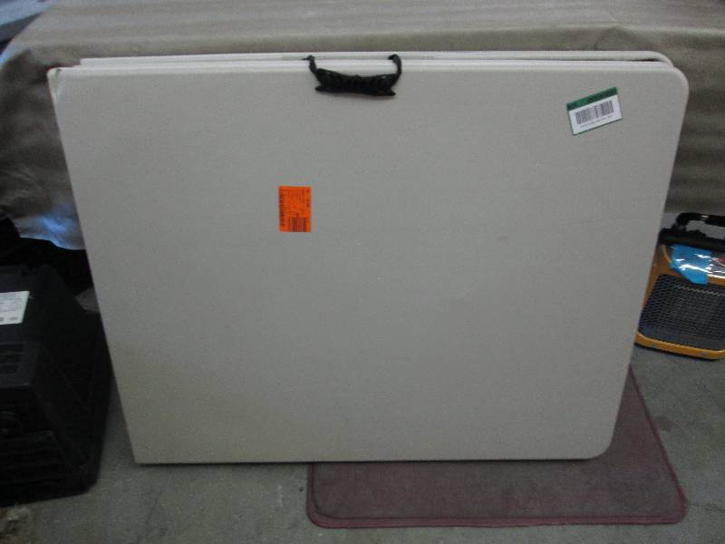 lot 35 image: HDX 6 Foot Folding Table- corner da...