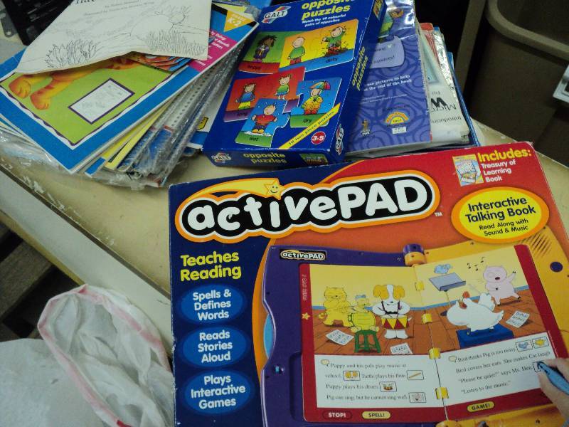 lot 56 image: Tub of childrens books, paper, and...