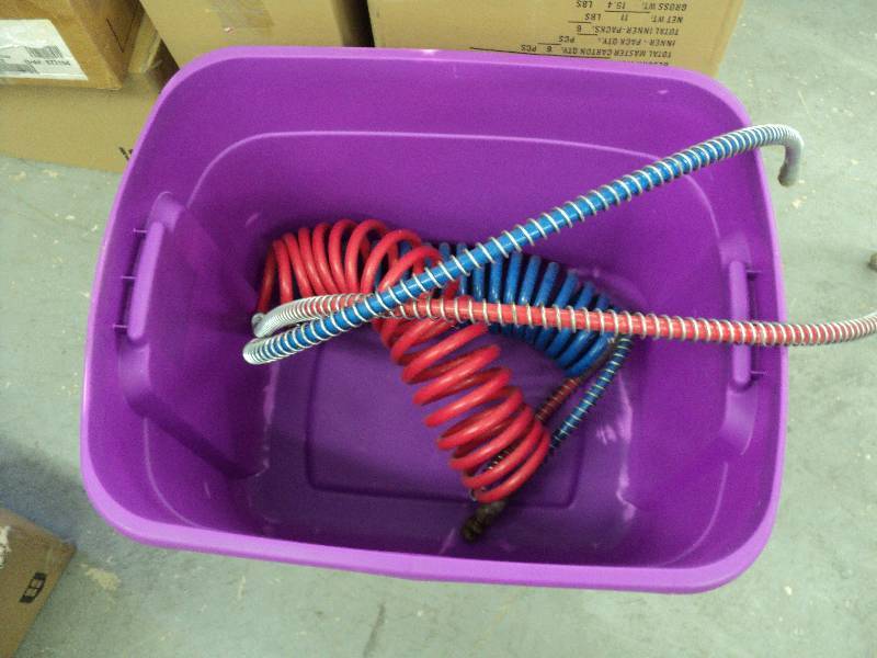 lot 94 image: Air hoses in tote...