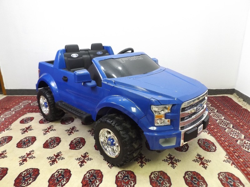 lot 7 image: WORKING Fisher Price 4 Wheeler Ford F-150 With Charger