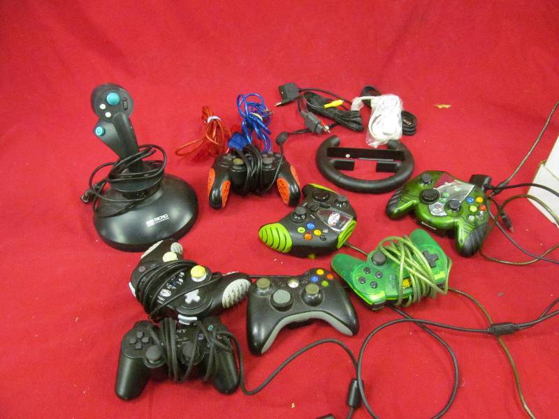 lot 84 image: electronic game controllers