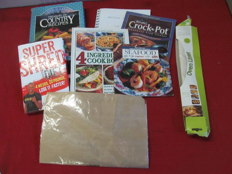 lot 129 image: cookbooks, oven liner, oven mate