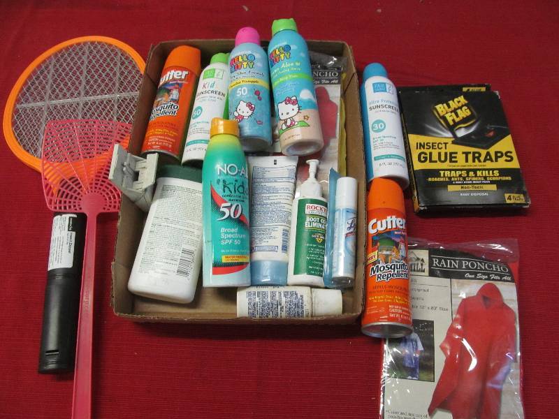 lot 164 image: rain ponchos, glue traps, sunscreen, bug spray, fly swatters